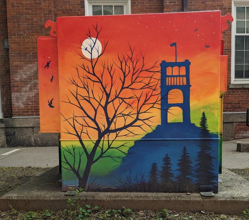photo of side of a red barn with signage